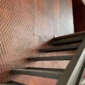 XSTONE Wall - 025 Coating Rust Diamond on the wall of a staircase