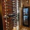 XSTONE Wall - 036 - Wallcovering Rust Diamond on a wall behind a rack of wine bottles