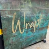 XSTONE Wall - 039 - Coating Copper Quarter on a rolling furniture as a signage