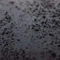 1085 XSTONE mineral veneer roll Travertine Black